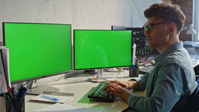 Manager typing chromakey pc sitting desk closeup. Man in glasses writing email