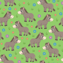 Kids cartoon seamless donkey pattern. Donkeys grazing in the meadow children's background. Green background with animals and flowers.