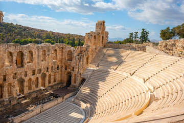 The Roman theater of Odeon of Herodes Atticus in the foreground and the Filopappou Hill in the...