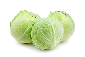Fototapeta premium Green cabbages resting on pristine white surface, highlighting fresh agricultural produce