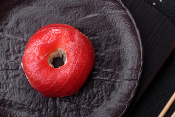 Donut shaped sushi rolls with salmon, shrimp and tuna