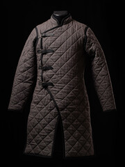 Historical fashion. Medieval knight cloth. Padded jacket gambeson.