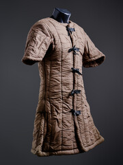 Historical fashion. Medieval knight cloth. Padded jacket gambeson.