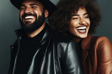 Couple enjoying a joyful moment with genuine laughter in a stylish indoor setting
