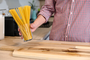 Preparing Spaghetti in a Modern Kitchen