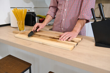 Man Preparing Meal in Modern Kitchen