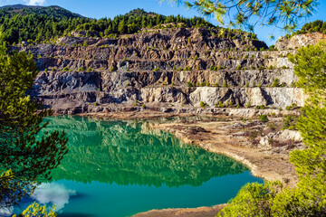 Serene Artificial Lake in Rocky Quarry Landscape