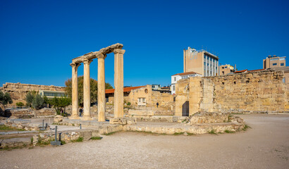 Naklejka premium The most famous architectural landmarks of ancient greek heritage located in the Plaka district in Athens, Greece: the library of Hadrian, Wind tower, medieval mosque