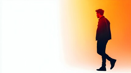 Obraz premium Silhouette of a Man Walking Away into a Warm Orange and Red Sunset