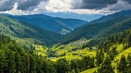 Naklejka premium Mountain valley village nestled in lush green hills under dramatic clouds