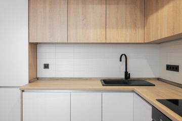 Faucet and granite sink in the kitchen