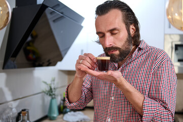 Man Enjoying Fresh Espresso in Kitchen