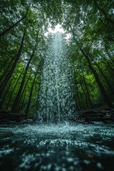 Waterfall cascading through lush green forest canopy