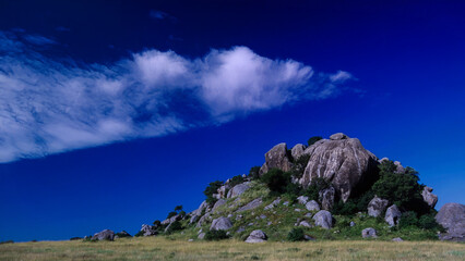 The Kopjes. Serengeti rocks, Tanzania, typical savanna landscape. East Africa wilderness. Photorealistic AI.