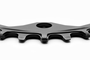 Close up of a black oval bicycle chainring against white isolated background. Professional bicycle...