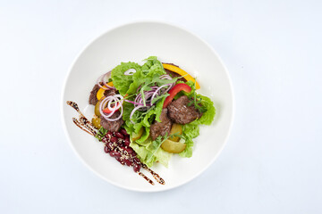 salad with beef in the white plate