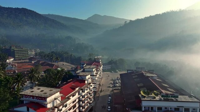 Adishakthyathmaka Sri Annapoorneshwari temple is on a serene riverbank, surrounded by lush green vegetation and foggy dense forest.