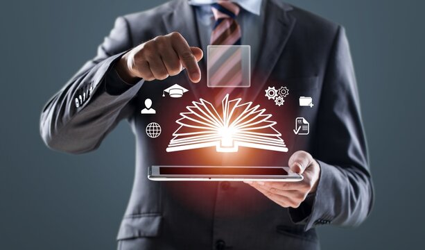 AI Education Book in businessman hand with icon AI Education