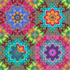 Bright multicolor seamless ethnic pattern with beautiful mandala flower in Indian style in vector.