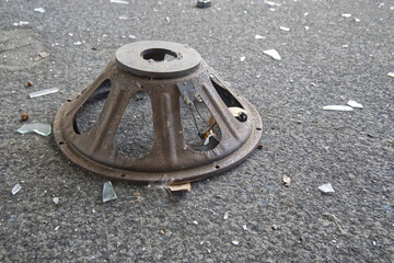 Rusty Speaker Cone on Carpet with Glass Shards