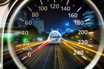 High speed on a speedometer in car and motion blur.
