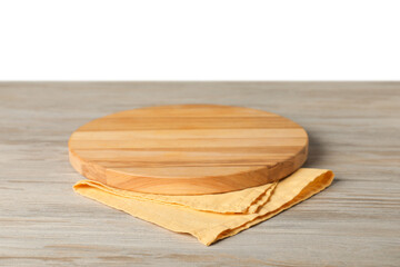 Yellow napkin and empty board on wooden table against white background
