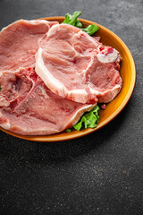 Pork on bones raw meat fresh tasty food dish delicious gourmet food background on the table rustic food top view copy space
