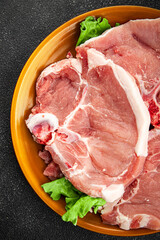 Pork on bones raw meat fresh tasty food dish delicious gourmet food background on the table rustic food top view copy space