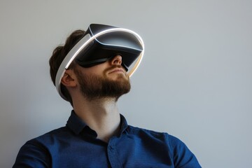 A man with a beard experiences immersive virtual reality using a headset with a glowing headband.