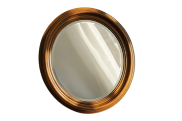 Round mirror with a wooden frame reflecting soft ambient light in a cozy interior space
