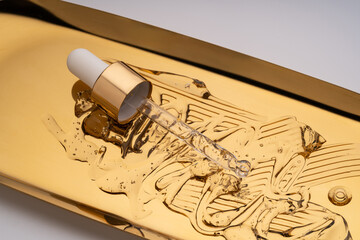 Pipettes serum with golden parts, anti-aging concept