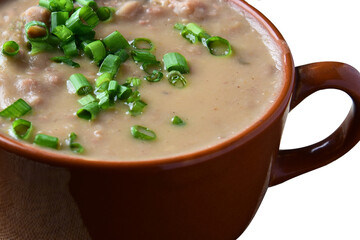 Delicious dish of Brazilian cuisine called Caldo de Feijão. Made with black beans, bacon and sausage. Bean broth. feijoada