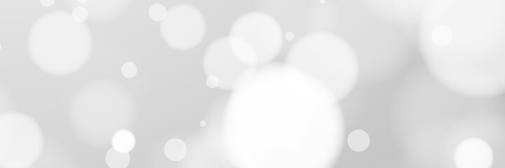 White bokeh background, light circles, soft blur, grey backdrop, website design
