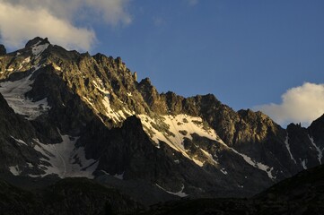 mountain landscape with snow,  tour of the Ecrins and Oisans Massif, hiking, trek, GR54, Alps, France, summer, holidays.