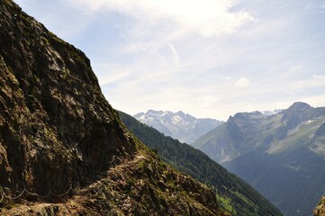 mountain landscape with clouds, difficult path,  tour of the Ecrins and Oisans Massif, hiking, trek, GR54, Alps, France, summer, holidays.