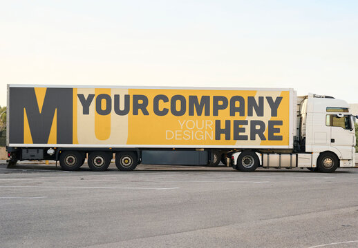 Large White Truck Parked in an Empty Lot During Daylight Hours