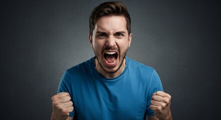 Naklejka premium Angry young man screaming and clenching his fists