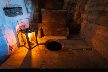Medieval Toilet: Ancient toilet within a stone castle, offering a glimpse into the sanitation...