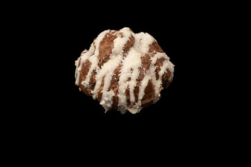 Profiteroles with coconut cream on a black background.