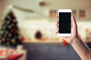 mobile phone with blank screen and Christmas  background.