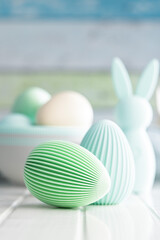 Easter decoration. Colorful eggs on white table.