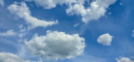 Blue sky with white clouds. The background is a clear blue sky without any cumulus clouds.
