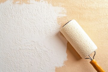 Obraz premium Painting wall with roller, light beige background