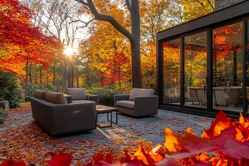 Foto op Canvas Autumnal backyard patio scene with modern furniture and fall foliage. © BerkahStock
