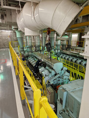 Motor man mechanic overhauling engine onboard drillship vessel
