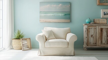 Coastal living room with armchair, ocean canvas, and rustic cabinet.