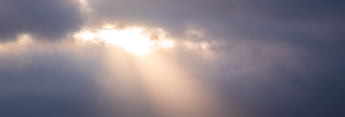 Sunlight coming from a dark sky