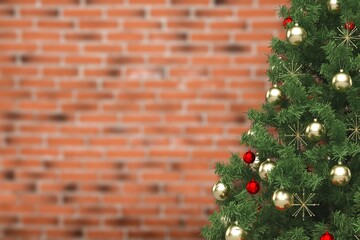 Christmas tree beautiful decorated with baubles near brick wall