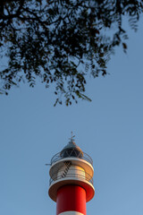 Obraz premium El Rompido Lighthouse (Huelva). architectural and touristic icon. beach and golf on the Costa de la Luz. spring and summer concept, sea. Spain