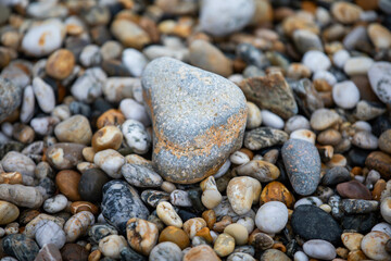 Rocks and pebbles along Marazion Beach in Cornwall, UK.